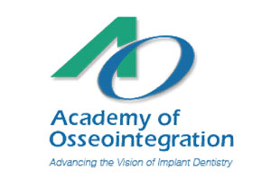 Academy of Osseointegration logo with green arrow and blue circle design for implant dentistry.