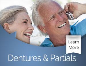 Smiling older man and woman against blue background with "Dentures & Partials" text and Learn More button.